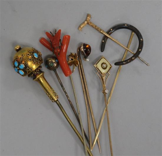 A group of assorted stick pins